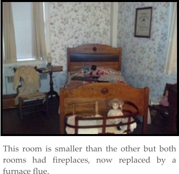 This room is smaller than the other but both rooms had fireplaces, now replaced by a furnace flue.